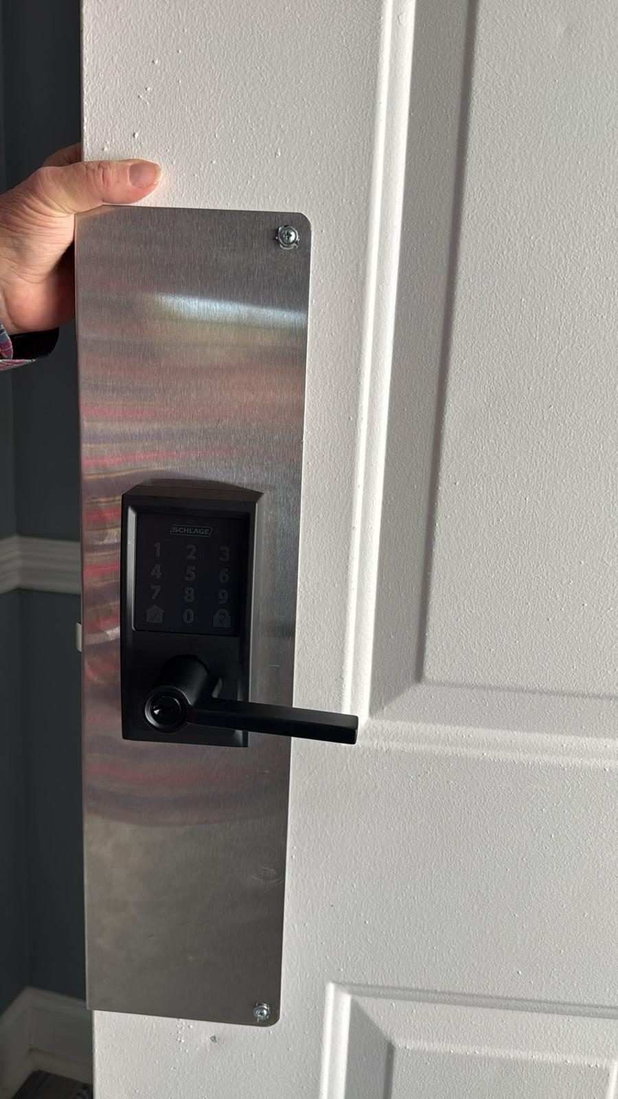 Schlage smart lock installed on white door - Foster City CA